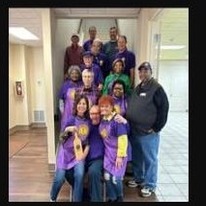 Kilgore Lions Club members in club aprons serving at the chili lunch