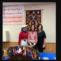 Guests including a Kilgore College Rangerette at a Kilgore Lions Club meeting