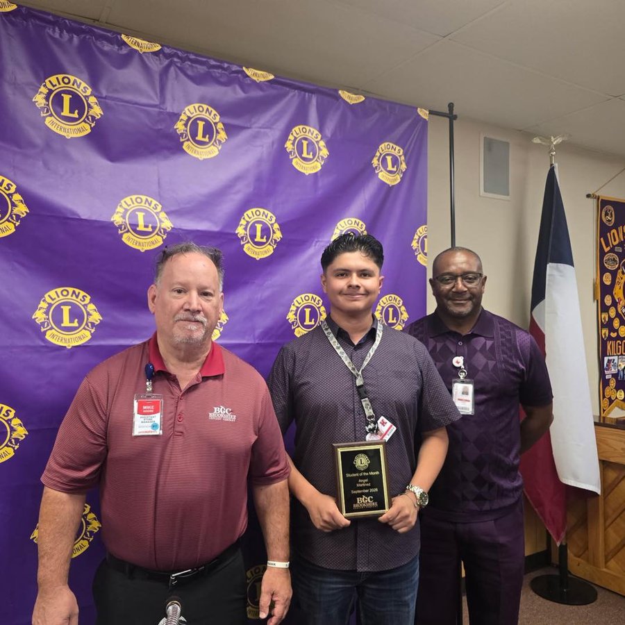 A Student of the Month receiving a plaque from the Kilgore Lions Club